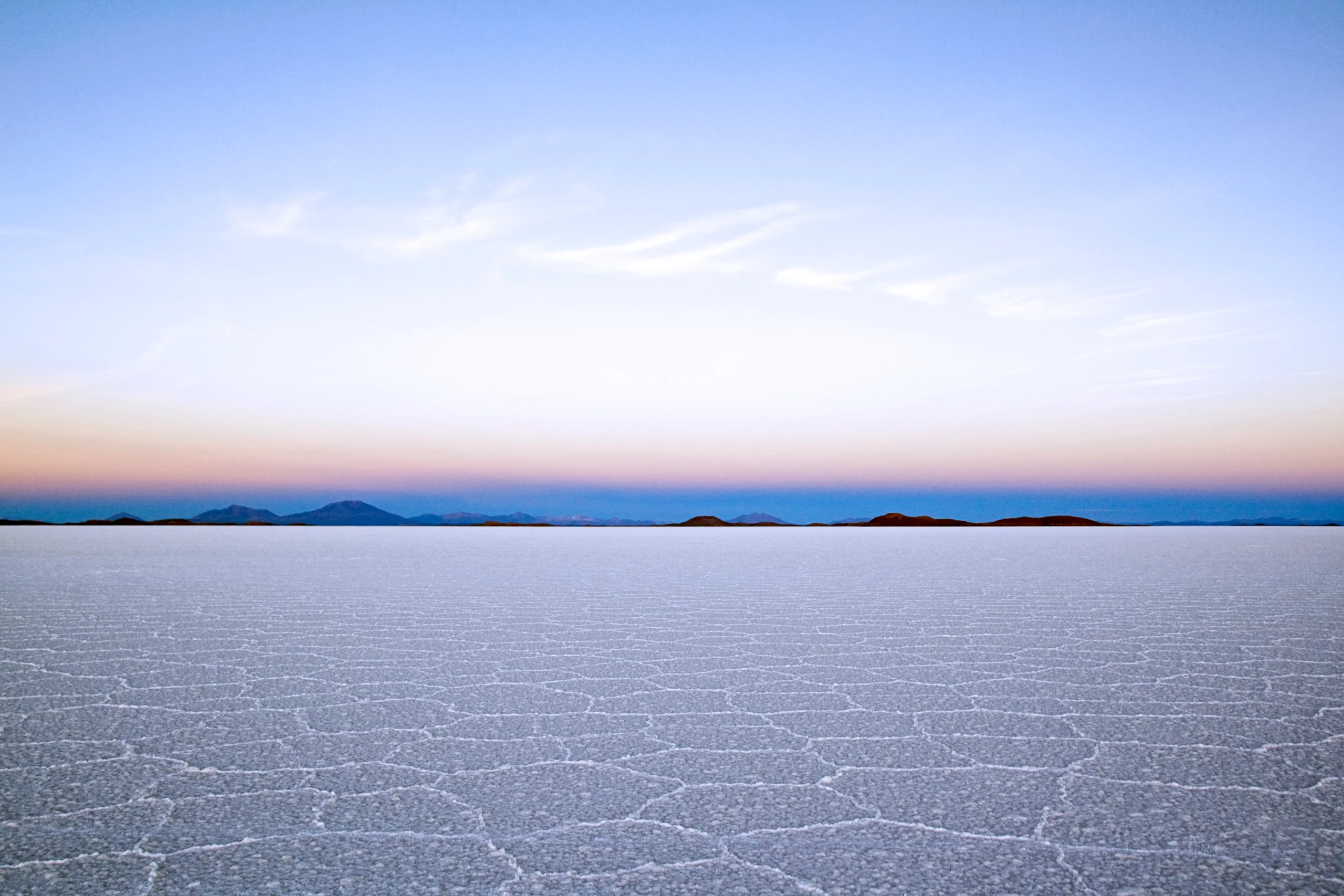 Sunset above salt flats in Salar de Uyuni